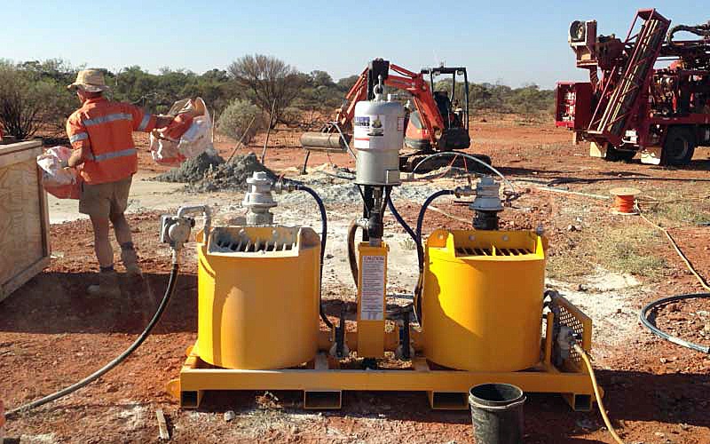 Heavy-duty, high-pressure Geogrouter in use on red dirt